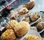 Scones White plate cake stands holding cheese and fruit scones.
