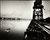 Swans in the river Tees by Smith’s Dock outfitting berth Boxing Day 1986 by Ian Macdonald A black and white photograph by Ian MacDonald. It shows a dock pier with raised platform structures on the right. On the left is a body of water with four swans in it. In the distance is an industrial landscape.