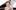 Olga-Stezhko-aspect-ratio-16-9 A person wearing a lilac top with brown hair tied up. They are sitting by a piano.