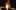 Zoe-Garner-Credit-Dave-Williams-January-25-aspect-ratio-16-9 A glass artist heats up a tube over a hot flame.