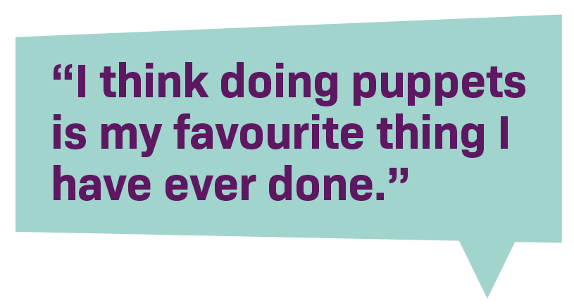 A turquoise rectangular speech bubble containing a quote in purple text that reads: 'I think doing puppets is my favourite thing I have ever done.'