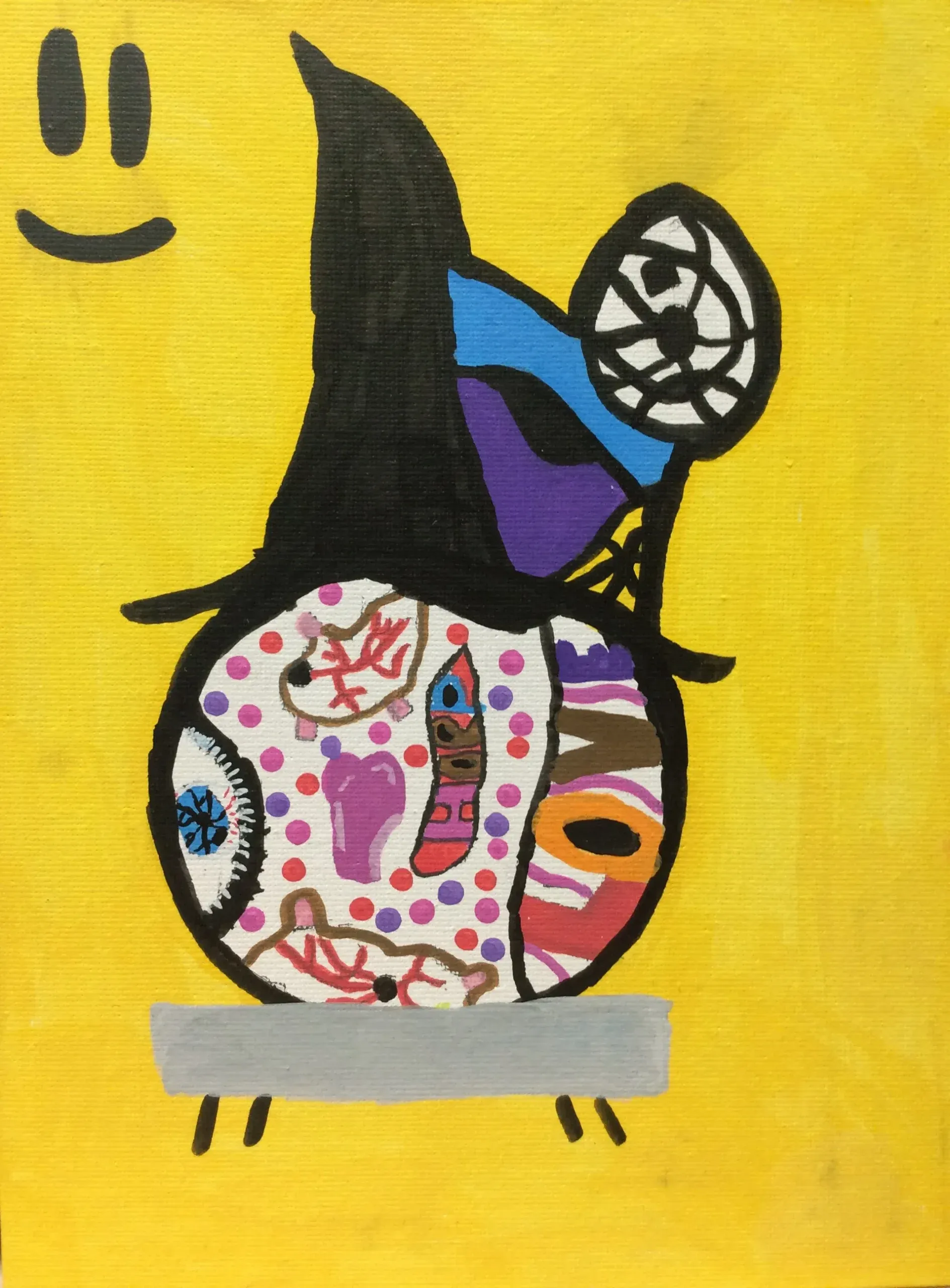 A bright drawing of a round character wearing a tall black pointed hat on a yellow background. The character is filled with patterns, hearts, and an eye. There is a black smiley face in the corner.