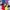 A rectangular graphic. The background is split into four block colours. Blue on the top left, Yellow bottom right, violet on the top right and red on bottom left. There are pop art illustrations of Emili Sandi, Audrey Amiss, Jill Scott and Louise Cook and Ida B Wells