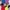 A rectangular graphic. The background is split into four block colours. Blue on the top left, Yellow bottom right, violet on the top right and red on bottom left. There are pop art illustrations of Emili Sandi, Audrey Amiss, Jill Scott and Louise Cook and Ida B Wells