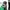 A small child in a checked shirt looks into a paper cup that is on a table with a green tablecloth