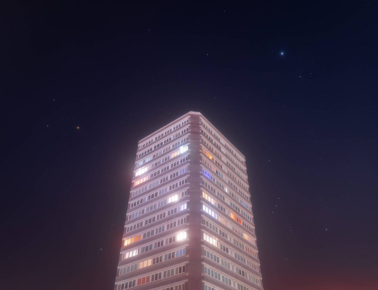 A large tower block at night, Many of the individual windows are lit with lights from inside the individual living spaces